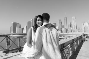 Engagement photoshoot showing off wedding ring, black and white portrait