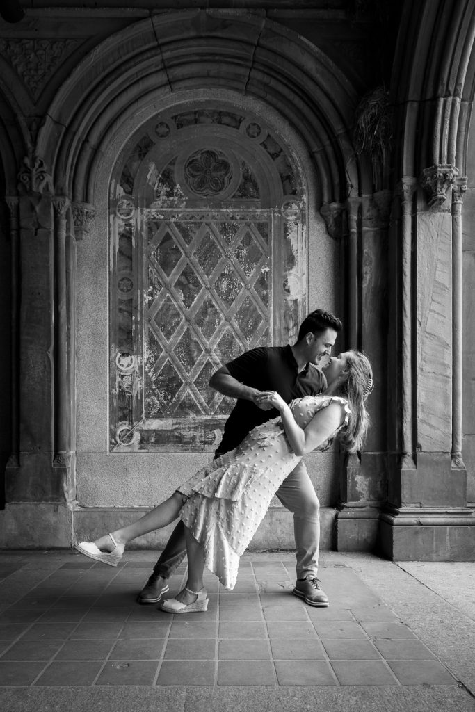 Surprise Engagement in Central Park, documentary style photoshoot for couples posing near Bethesda terrace