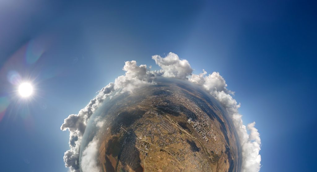 Insta 360 X5 Aerial view from high altitude of little planet with distant city