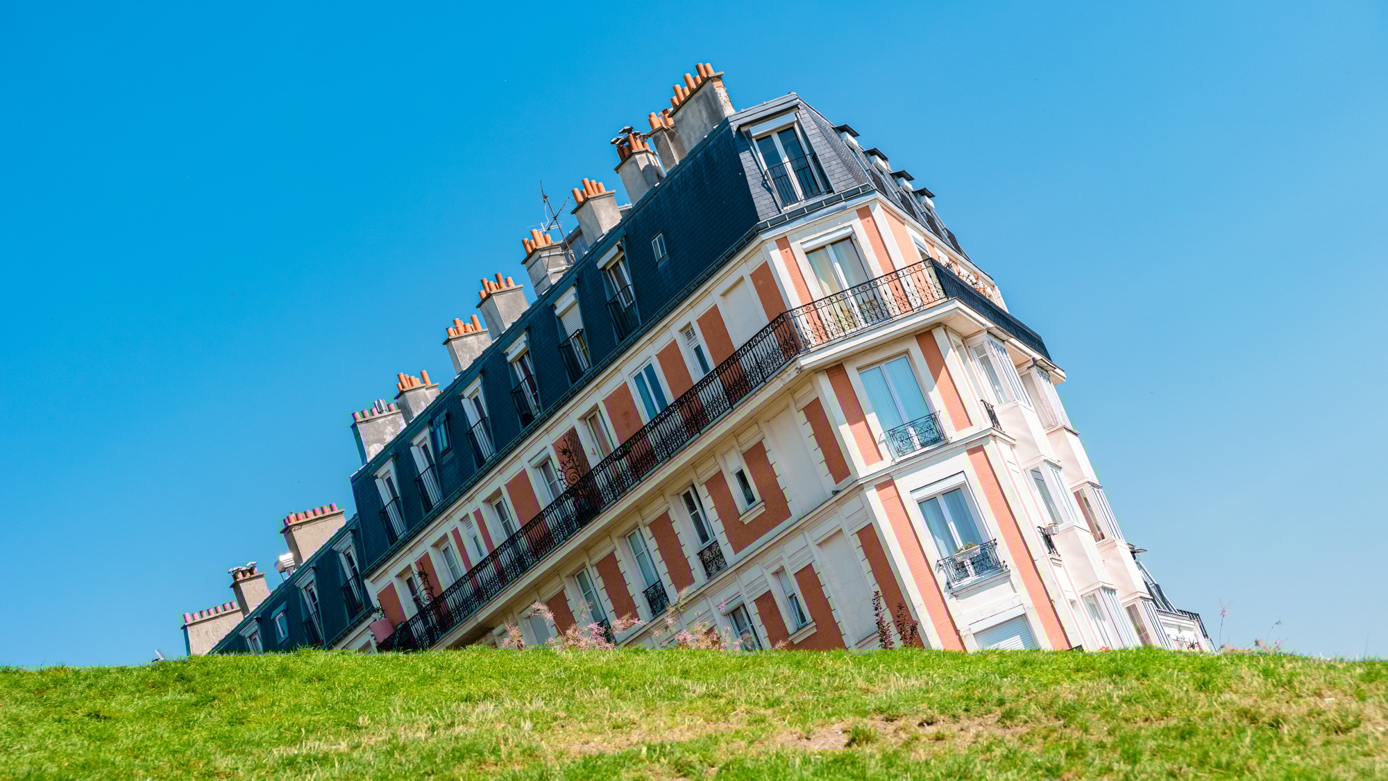 Forced perspective photography. The sinking house in Montmarte, Paris Optical illusion Paris, France, morning in Paris
