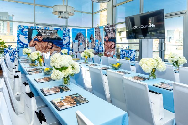 Branded event stage at a corporate conference in Manhattan, with lighting and signage details.